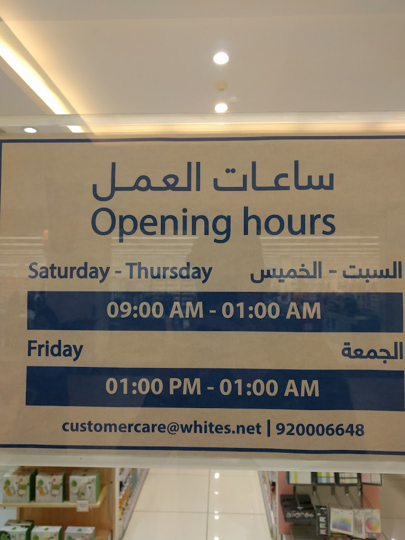 A sign displaying the opening hours for Whites, including contact information.