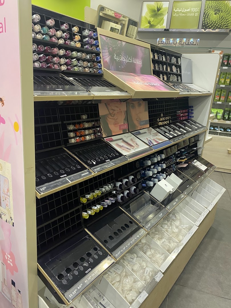 A display of makeup and beauty products, including nail polish and testers, at Yves Rocher.