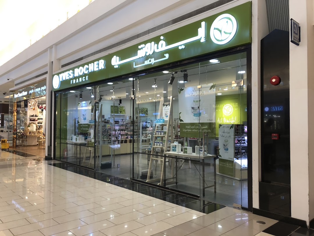 The storefront of Yves Rocher, a beauty and skincare shop, with products displayed inside.